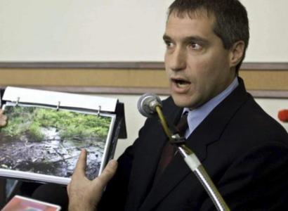 White man talking into a mic