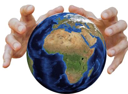 Two hands going around the earth