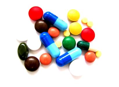 A pile of colorful and different sized pills