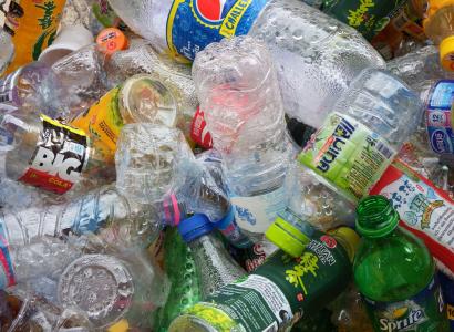 Colorful photo of empty plastic bottles all lying on top of each other in a heap