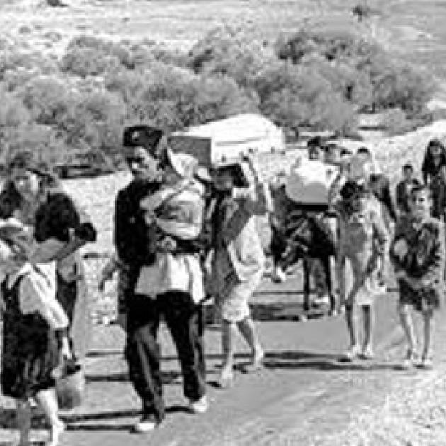 Refugee families walking on a road