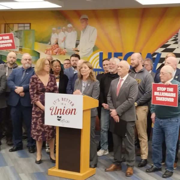 Union members surrounding Amy Acton at press event