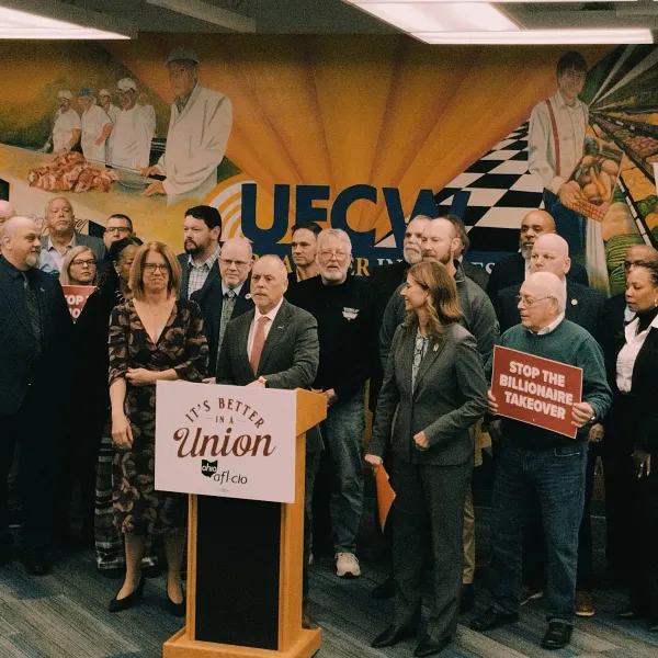 Union members speaking at press event