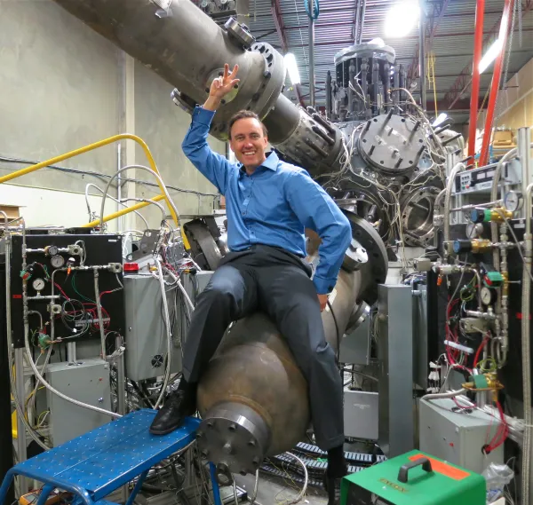 Steam punk fusion man riding what looks like a bomb but is in laboratory 