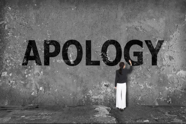 Apology painted on wall