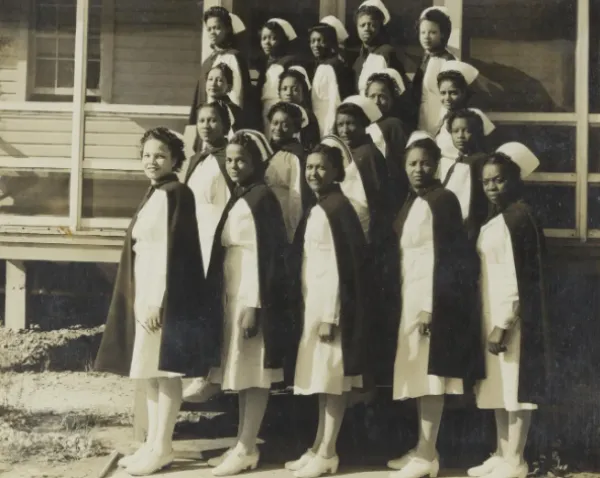 Women posing in uniforms