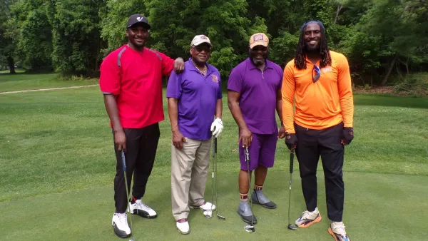 Men  posing with golf clubs