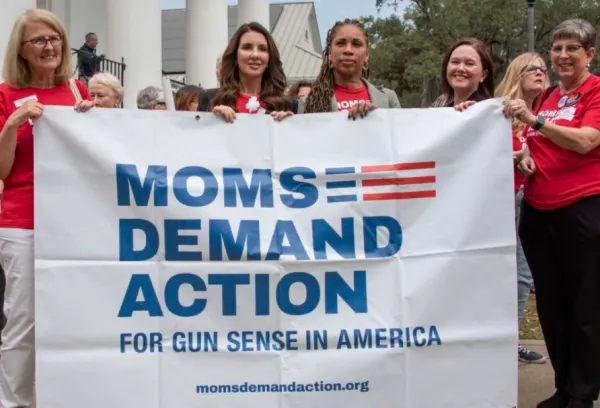 Women holding a banner