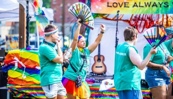 People marching in bright colors