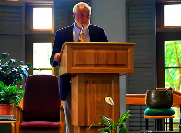 Man talking at a podium