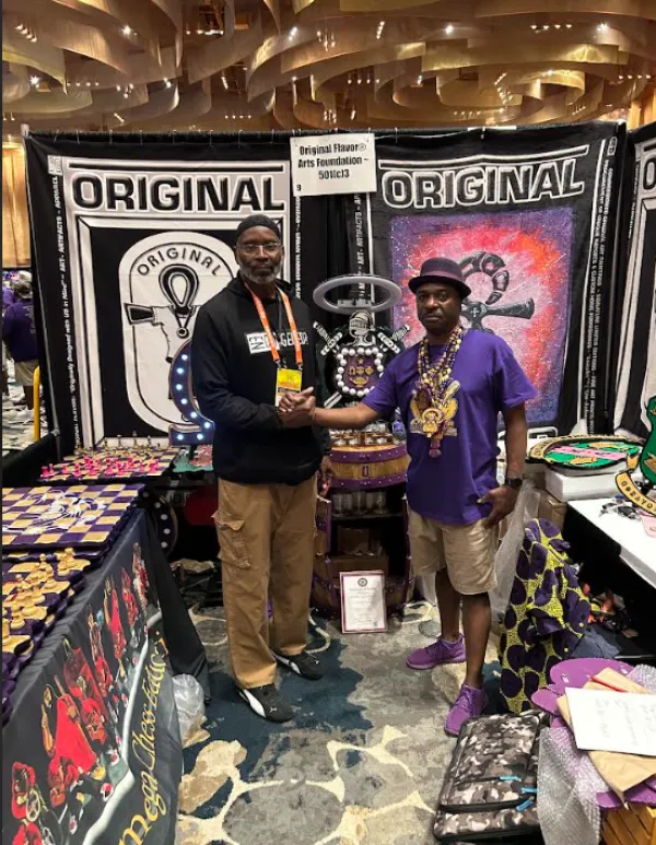 Two men shaking hands at an event