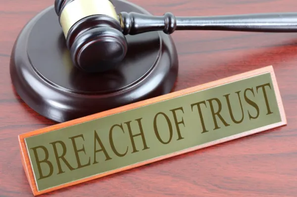 Gavel and words Breach of Trust