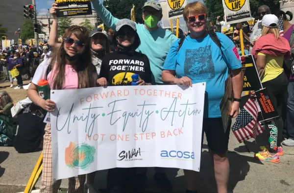 People holding a banner