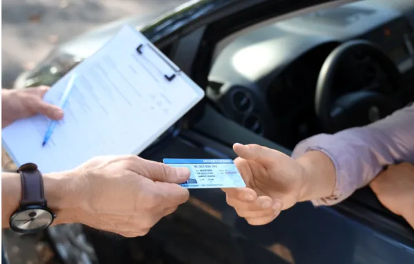 Handing a drivers license thorugh window