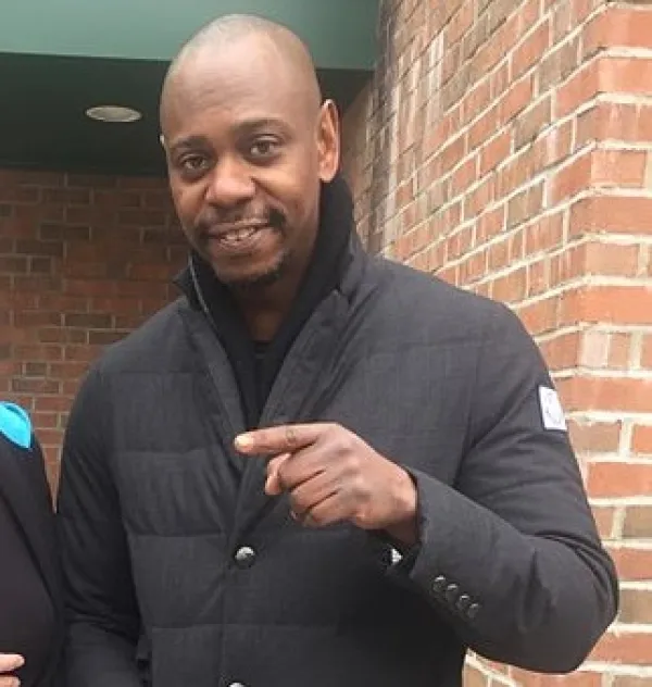 Black man pointing to the left