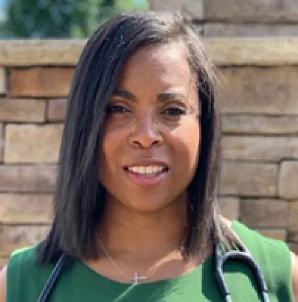 Black woman in green dress