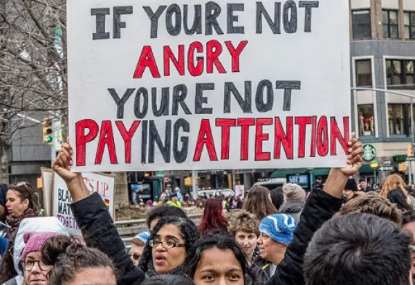 Sign saying If you're not angry, you're not paying attention