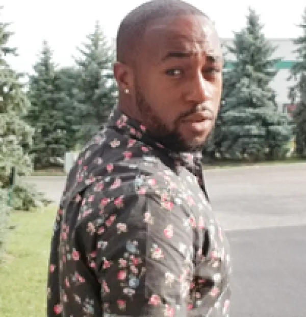 Black man turning to look behind him 