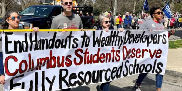 People holding banner in a march
