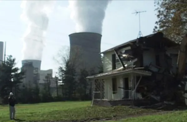 Broken down house and nuclear reactor spewing smoke