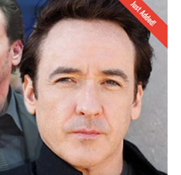 White man's face looking squinty eyed toward the camera without a smile 