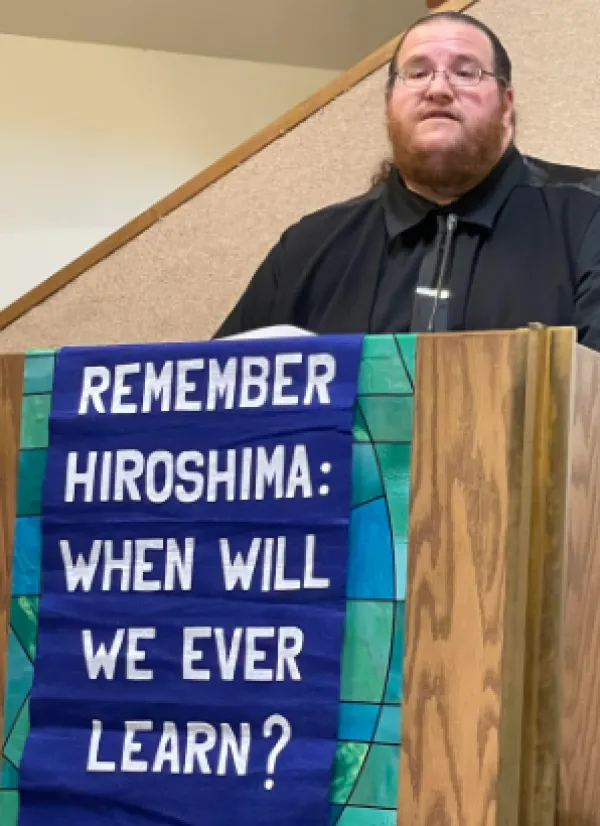 David speaking at podium