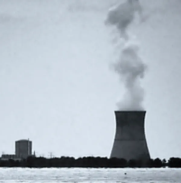 Nuke plant on the water with smoke