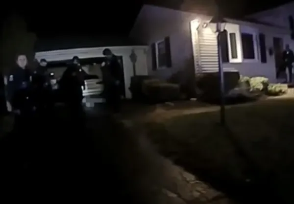 Police outside a house at night