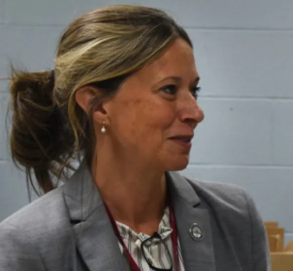 White woman with her hair pulled back