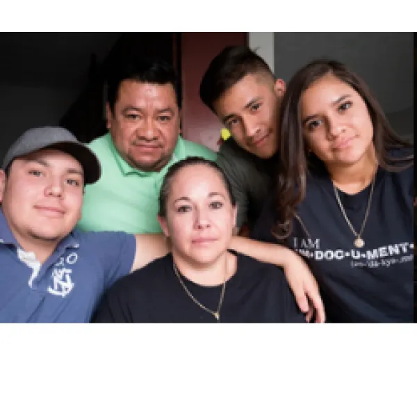 Edith surrounded by four other Latino people