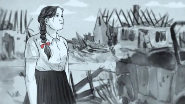 Woman next to bombed out buildings