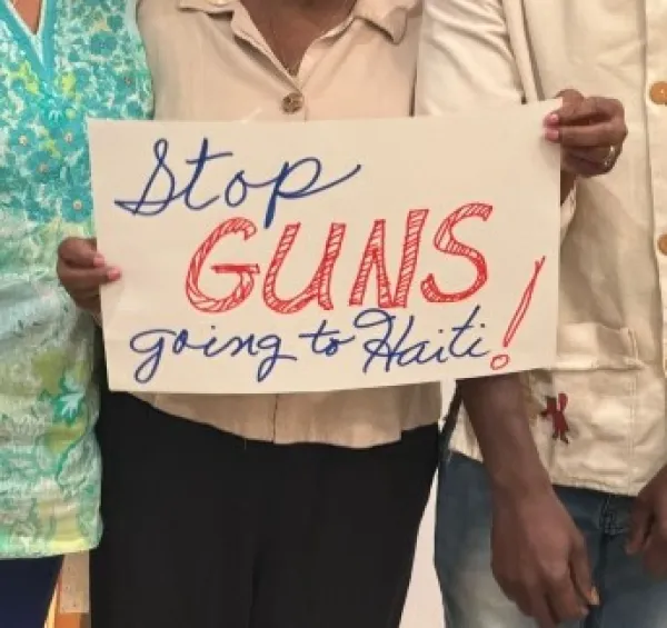 Sign saying Stop Guns going to Haiti