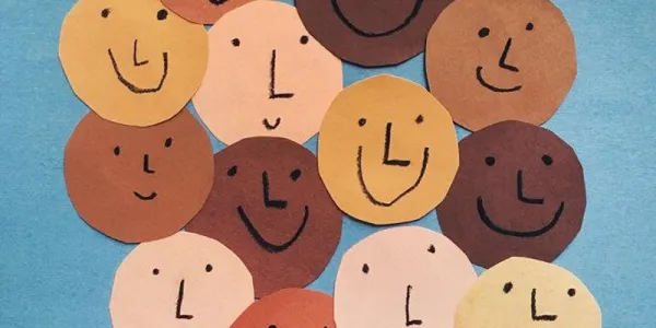 Lots of different colored skin happy faces