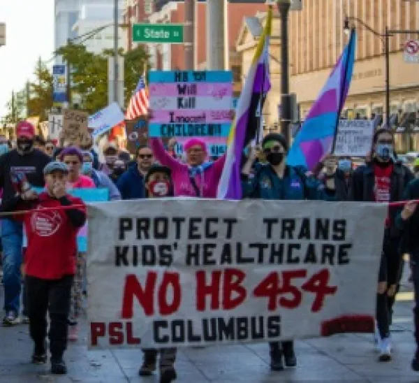 People holding sign and marching