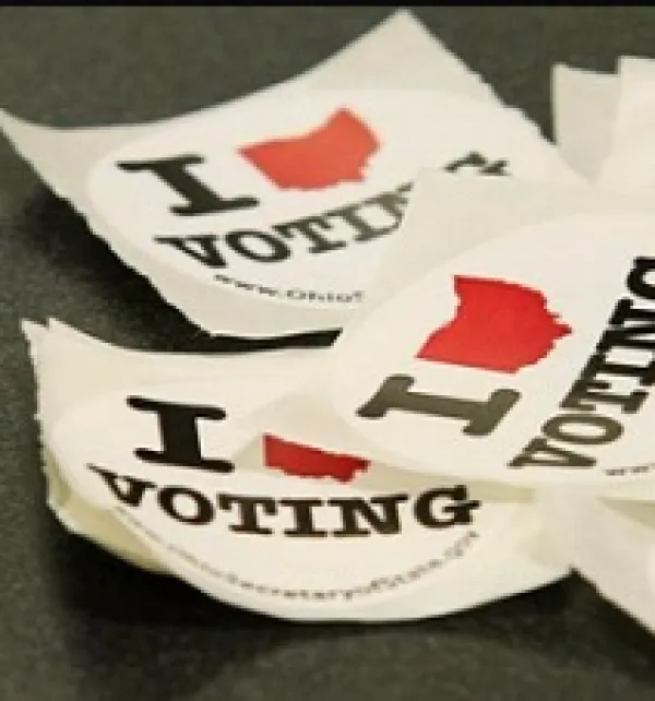 Stickers that say I, then a red silhouette of the state of Ohio that looks like a heart and then the word votng