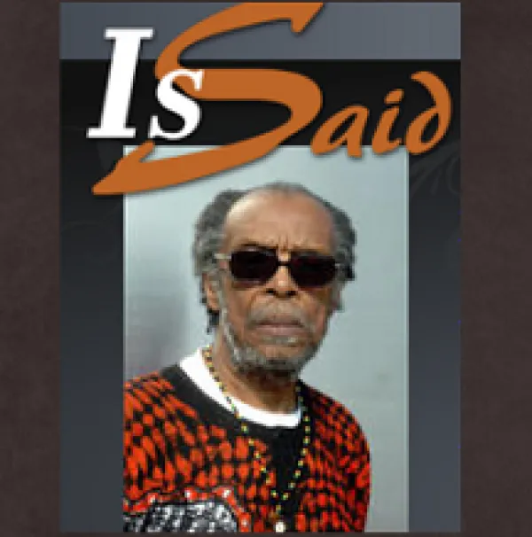 Black man with gray hair and sunglasses and the words Is Said