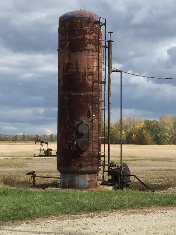 Tall metal structure out in a field - an injection well