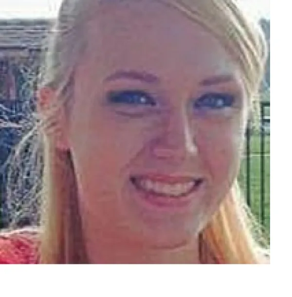 Young white woman with long striaght blonde hair smiling