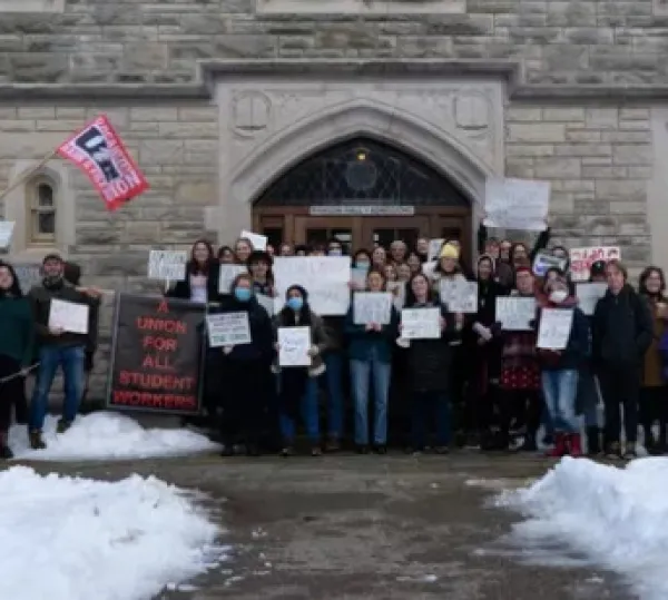 Students holding signs