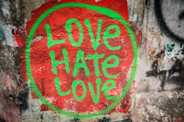 Love Hate Love spray painted on a wall