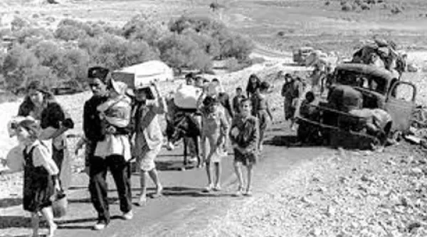 Refugee families walking on a road