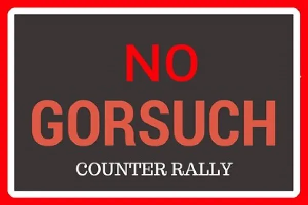 Red words on black saying No Gorsuch counter rally