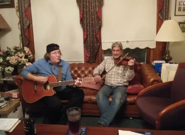 Dan Dougan and Steve Caruso playing instruments