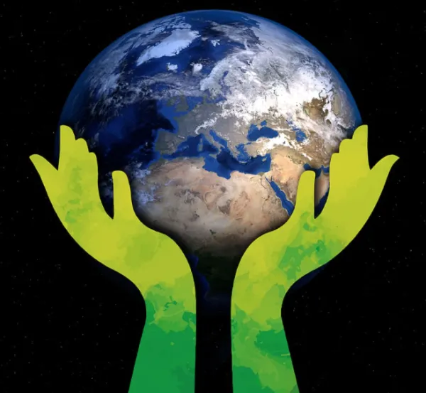 Two hands holding the Earth