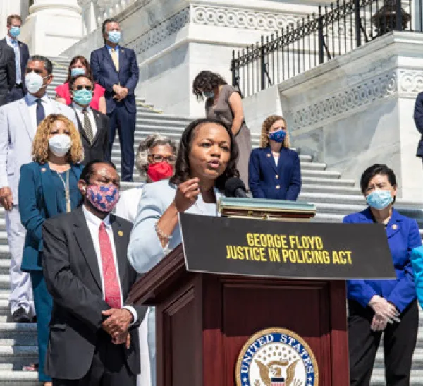 Woman speaking at a podium