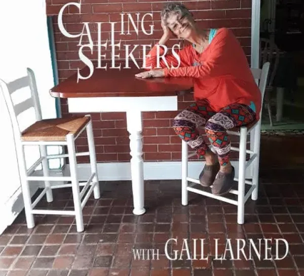 Woman sitting at a patio table