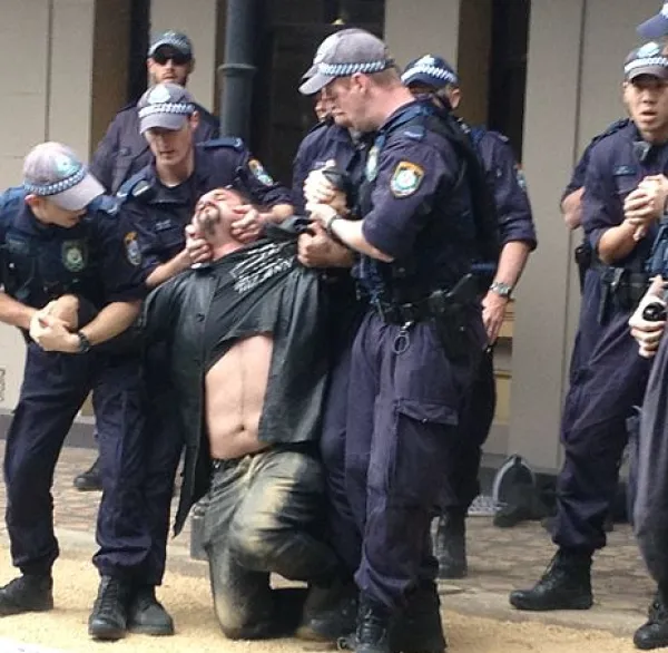 Police using excessive force on a man