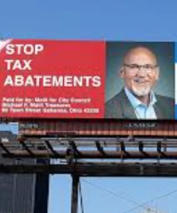 Billboard that says Stop Tax Abatements with Joe Motil's face