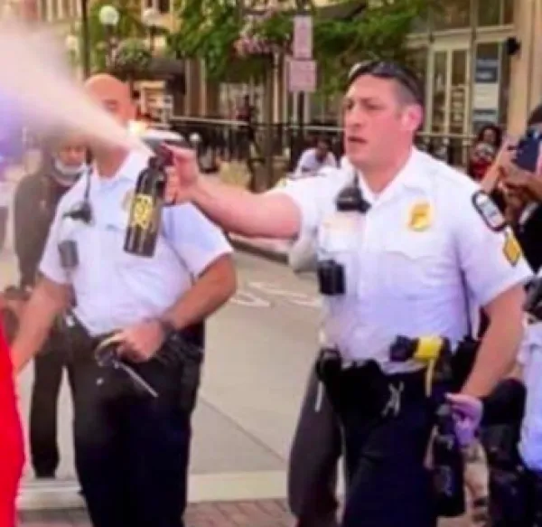 Police spraying pepper spray