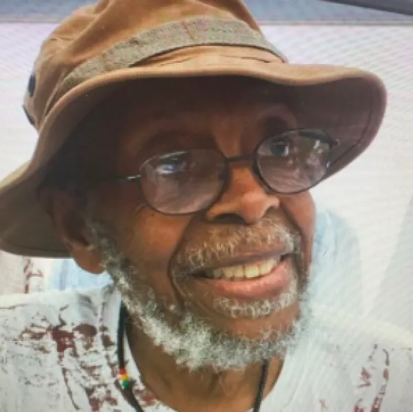 Black man wearing a hat
